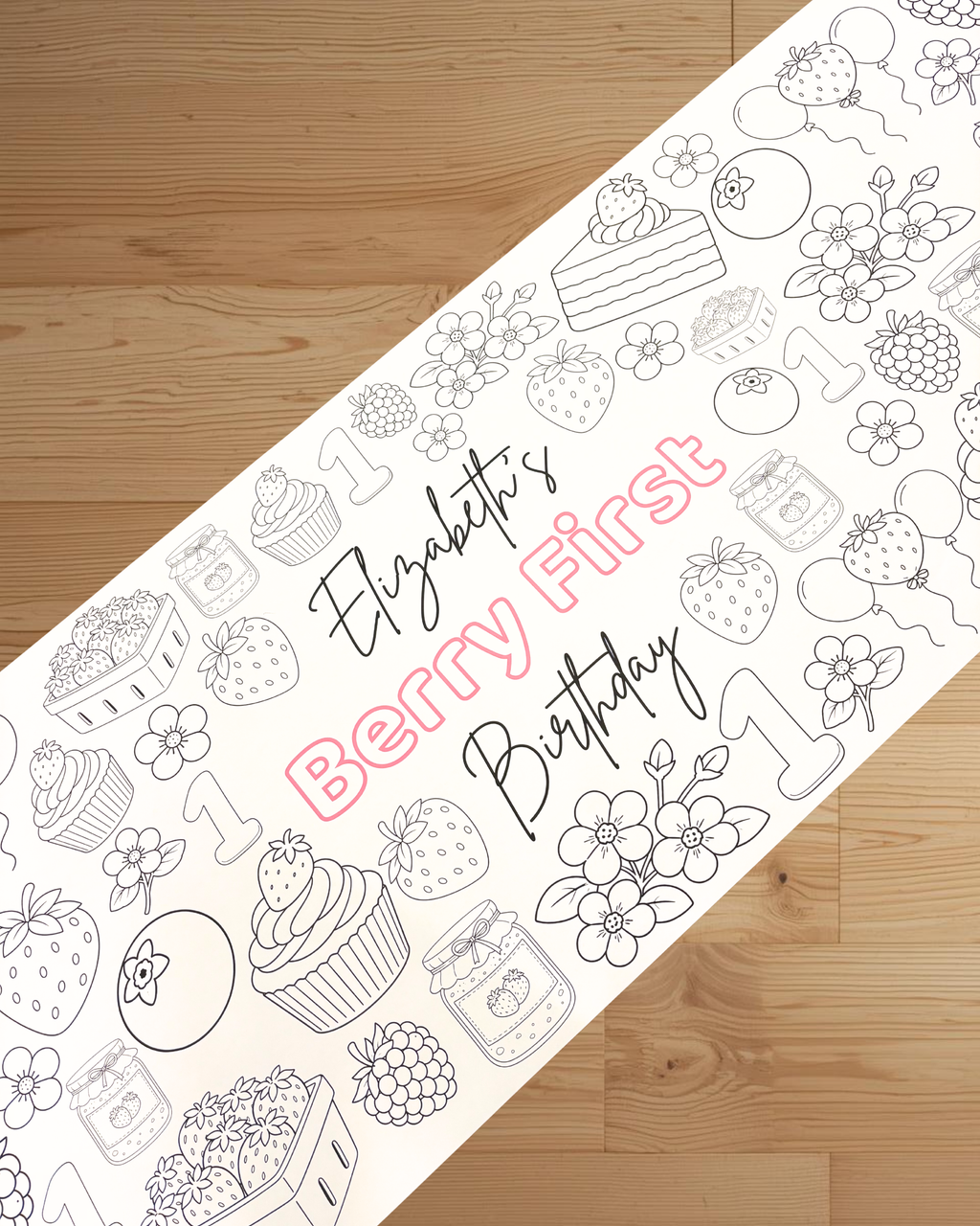 Coloring sheet with berry-themed design and text on a wooden surface