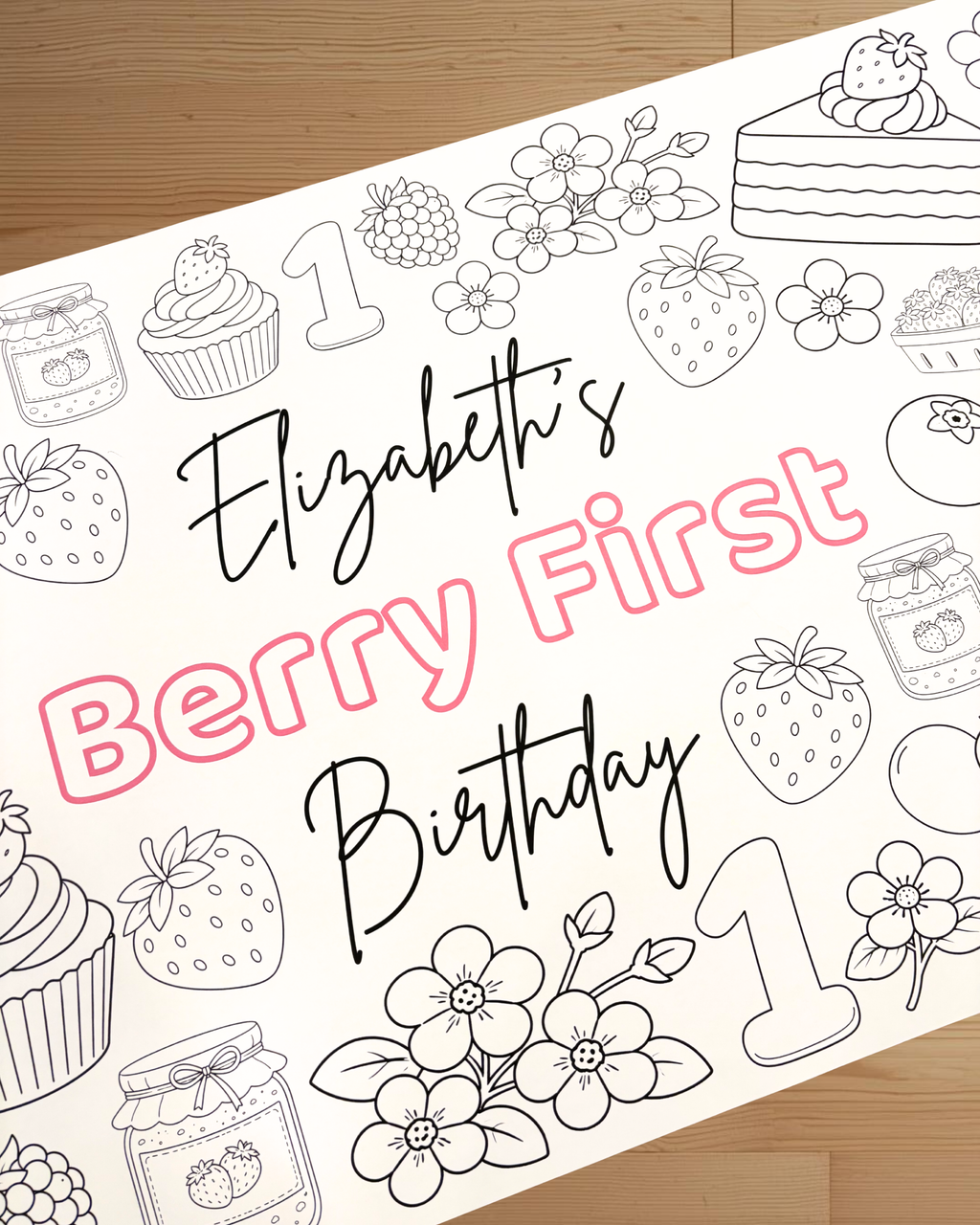 Coloring sheet with 'Elizabeth's Berry First Birthday' text and berry-themed illustrations on a wooden surface.